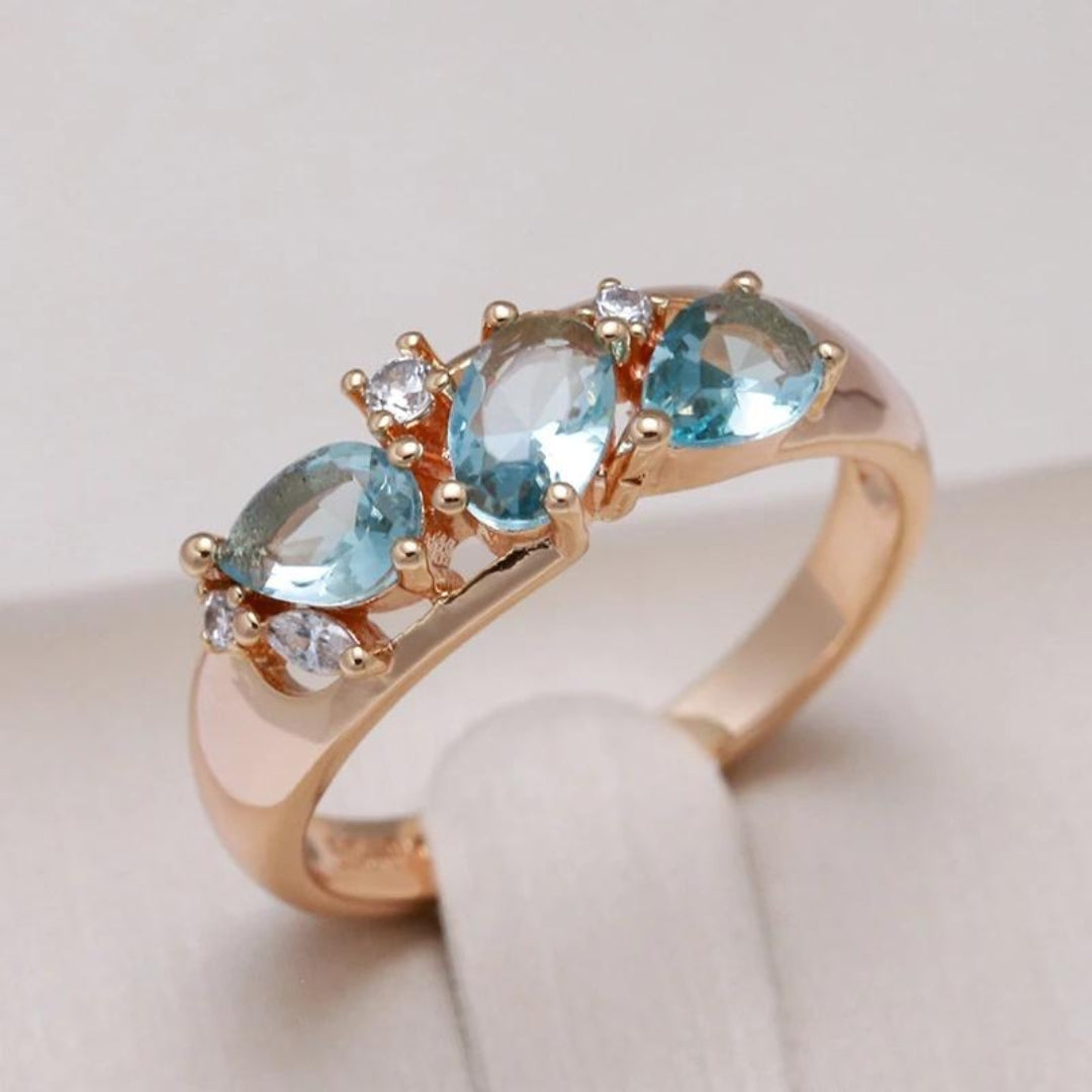 Gold ring with blue crystal in vintage style