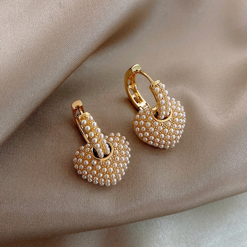 Gold flower-shaped earrings with cubic zirconia