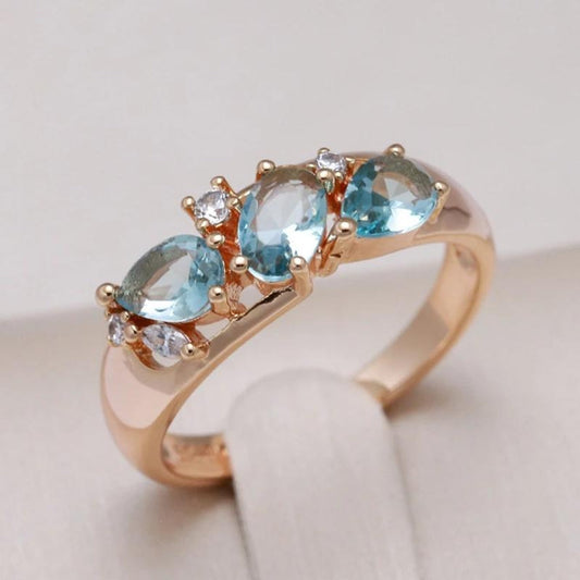 Gold ring with blue crystal in vintage style