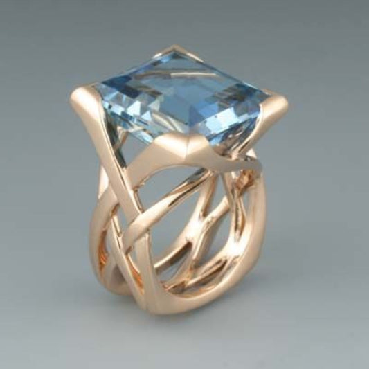 Pink ring with blue cubic zirconia in vintage style