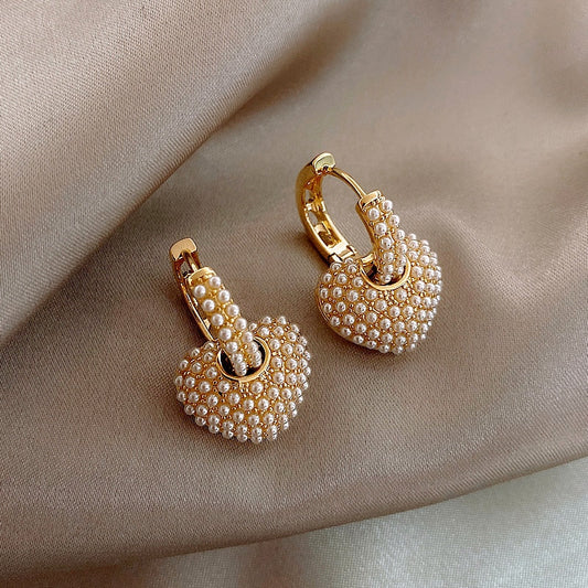 Gold flower-shaped earrings with cubic zirconia