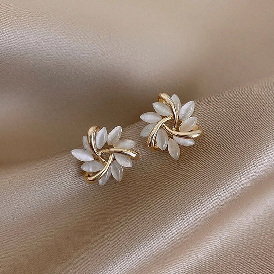 Elegant gold and silver nut earrings