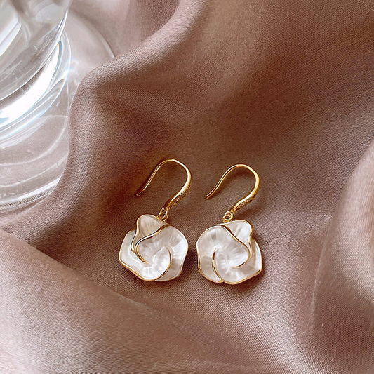 Elegant earrings with white petal design