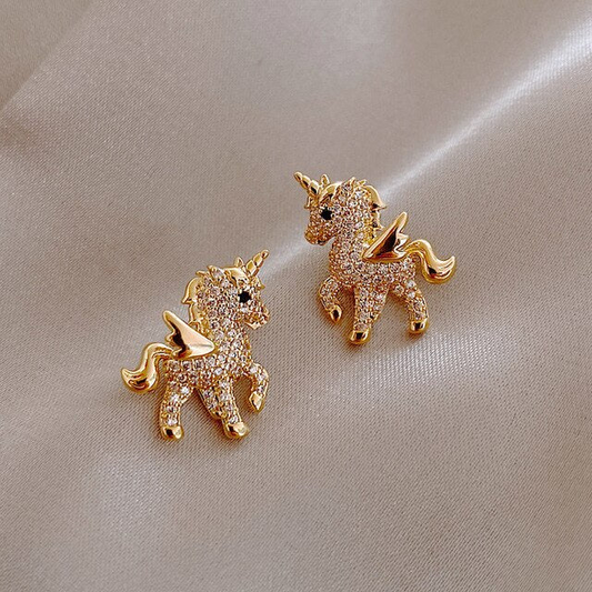 Unicorn earrings shimmering with gold