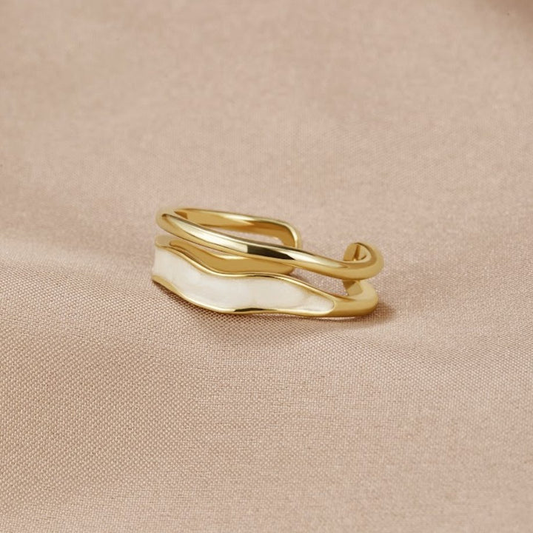 Elegant gold ring with white enamel